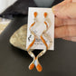 Navajo Snake Swirl Earrings | Orange Spiny Opal Inlay | Sterling Silver | 3.25" | 1548